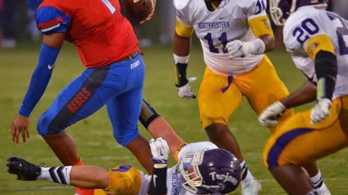 Northwestern defensive end Logan Rudolph, bottom, has received lots of offers to play for major college football programs, including South Carolina.