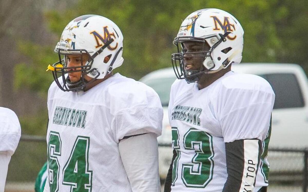 Mallard Creek (NC) offensive linemen Eric Douglas (64) and TJ Moore (63) during Shrine Bowl practice. Douglas is committed to South Carolina, while Moore remains a target.