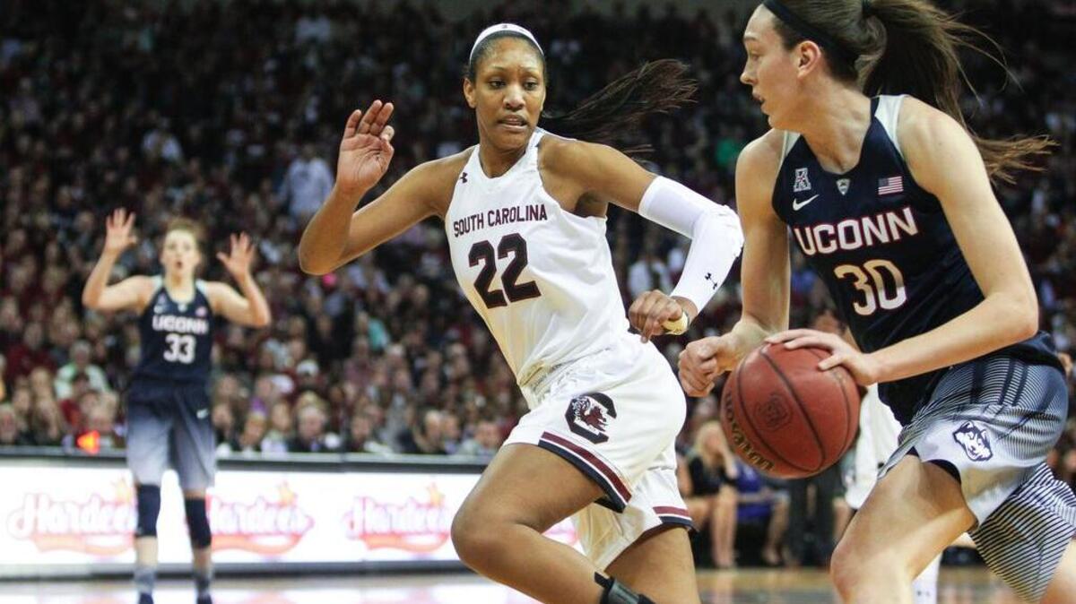 South Carolina's A'ja Wilson (22) defends Connecticut's Breanna Stewart (30) during the a game in February. Both are nominated for player of the year