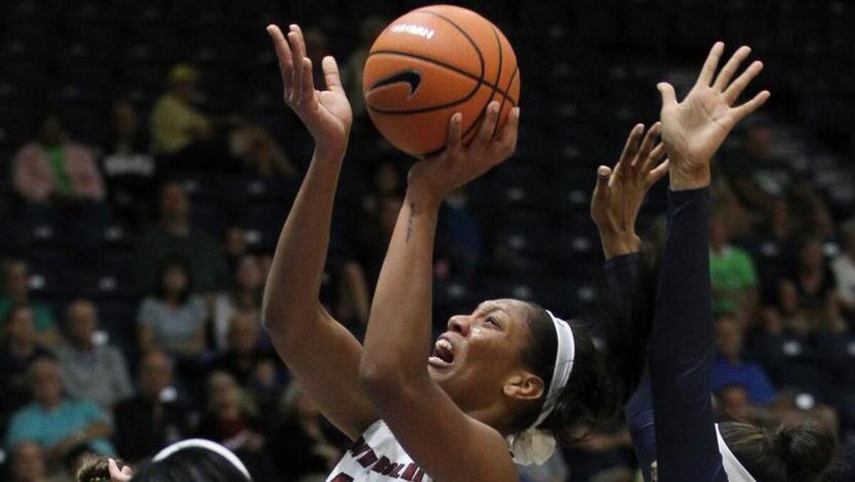South Carolina's A'ja Wilson (22) shoots against Notre Dame's Jackie Young (5) and Notre Dame's Kristina Nelson, right, during the first half of an NCAA college basketball game Sunday