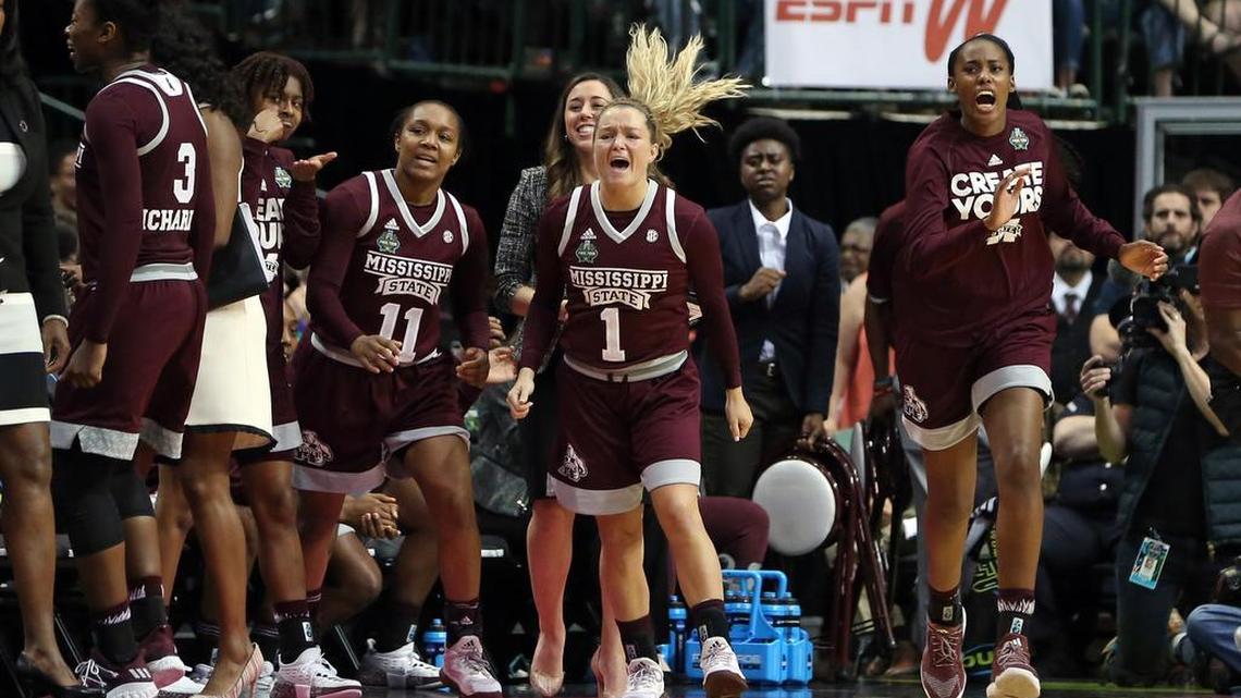 Mississippi State guard Roshunda Johnson (11) and guard Blair Schaefer (1) react with the bench during the game Friday against the Connecticut Huskies in the Final Four.