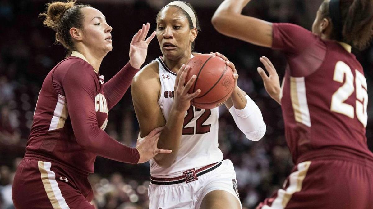 South Carolina forward A'ja Wilson (22) drives to the hoop against College of Charleston center Baileigh Larson, left, and Deja Ford (25) during the first half of an NCAA college basketball game Tuesday, Dec. 5, 2017, in Columbia, S.C.