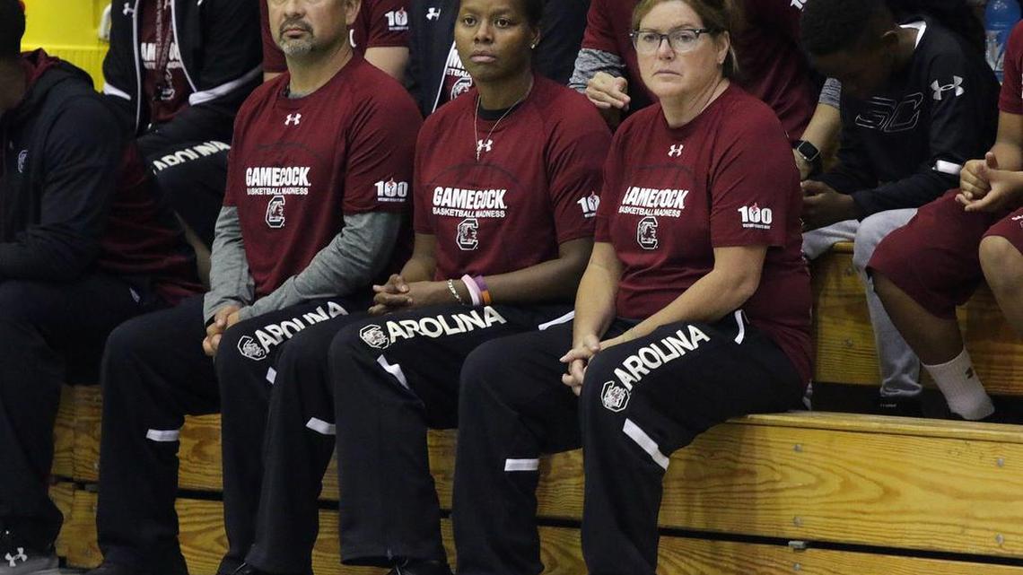 South Carolina women's basketball assistant coaches Fred Chmiel and Nikki McCray-Penson, and director of coaching offensive analytics Melanie Balcomb.