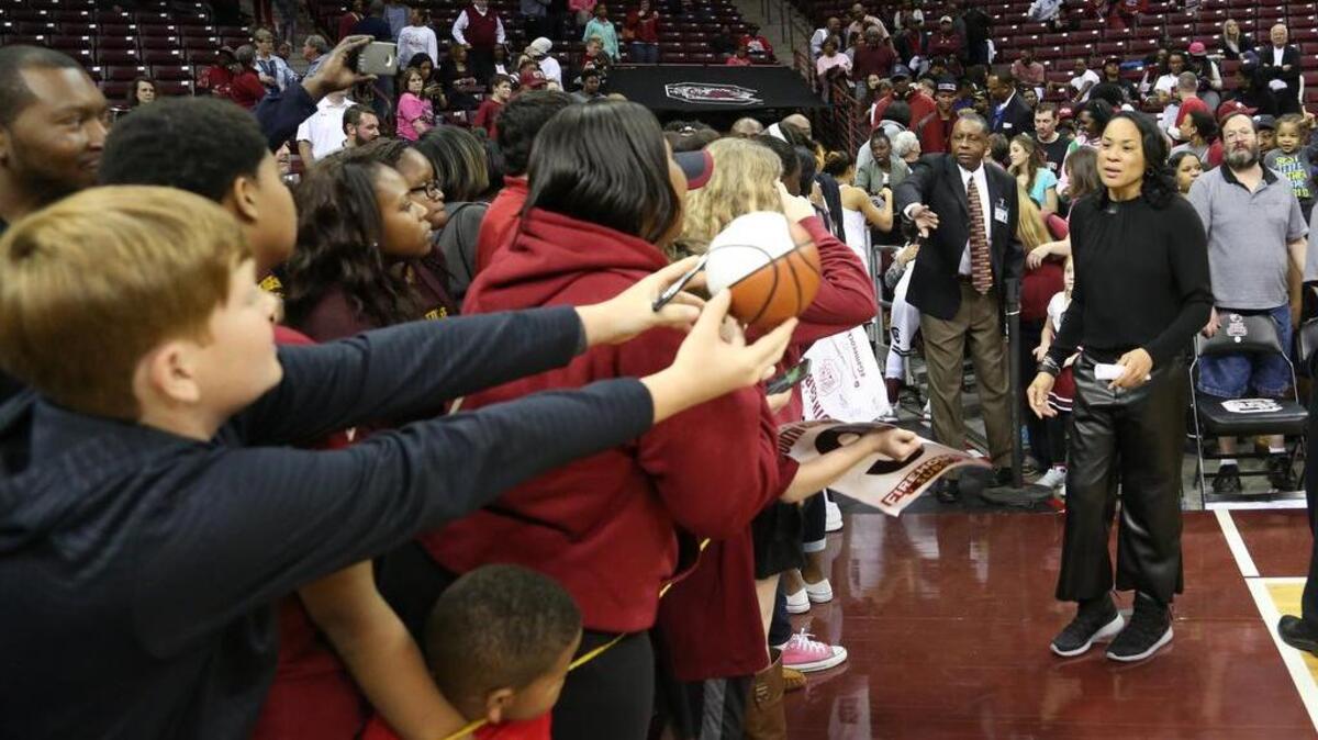 Fans clamor for autographs after the Gamecocks’ last regular-season game.