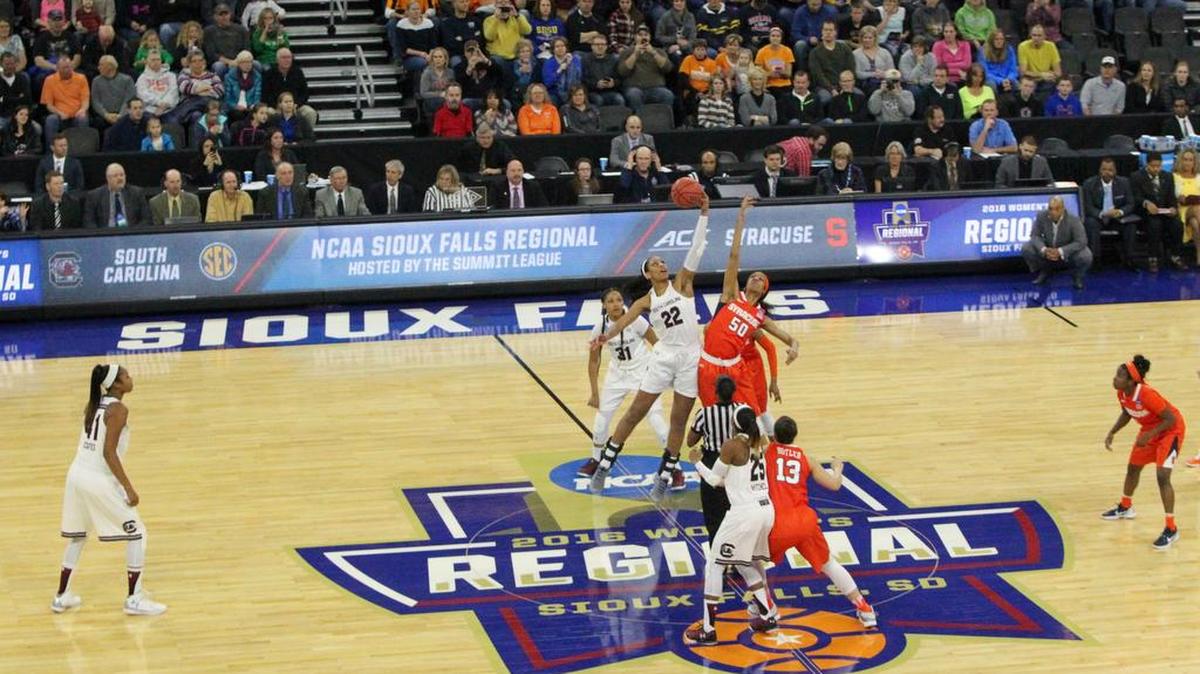South Carolina's A'ja Wilson (22) and Syracuse's Briana Day (50) face off at center court to start the Friday night’s game.