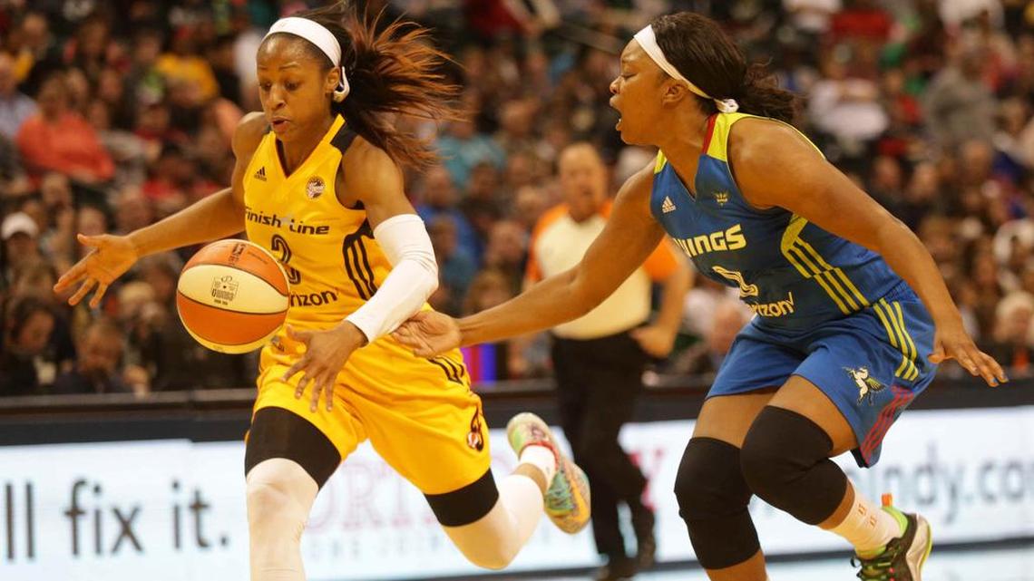 Indiana Fever's Tiffany Mitchell, left, gains possession of a ball knocked loose from Dallas Wings' Odyssey Sims during a WNBA basketball game Saturday, May 14, 2016, in Indianapolis.