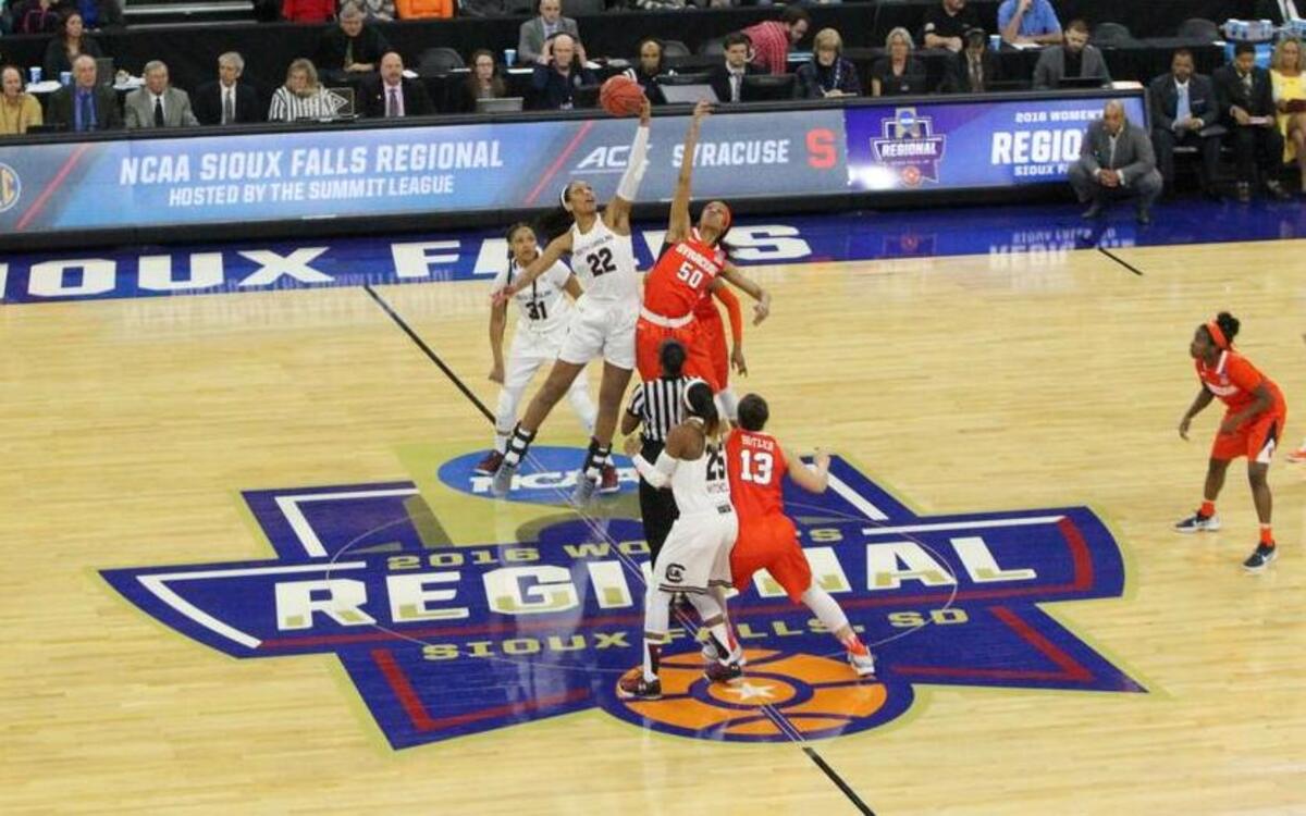 South Carolina's A'ja Wilson (22) and Syracuse's Briana Day (50) face off at center court to start the Region 1 semifinals at the Denny Sanford Premier Center in Sioux Falls, SD.