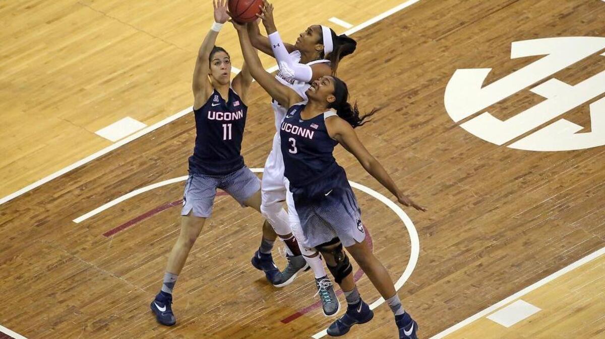 Alaina Coates drives against Connecticut.