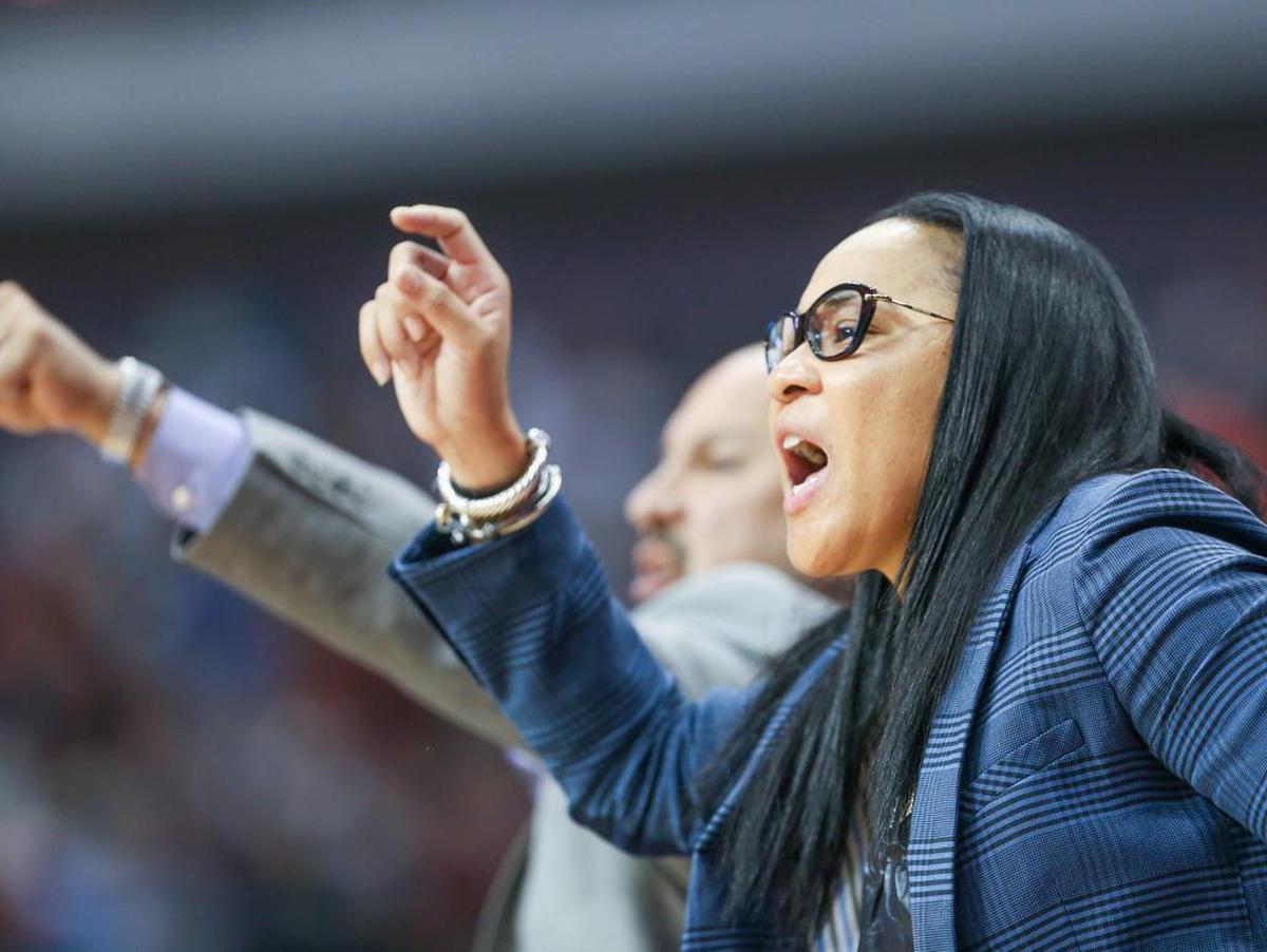 Coaches Dawn Staley and Fred Chmiel yell to the team during the second half of action in the NCAA Women’s National Championship Semifinal game at the American Airlines Arena in Dallas, TX. USC beat Stanford 62-53 and will play for the Championship.