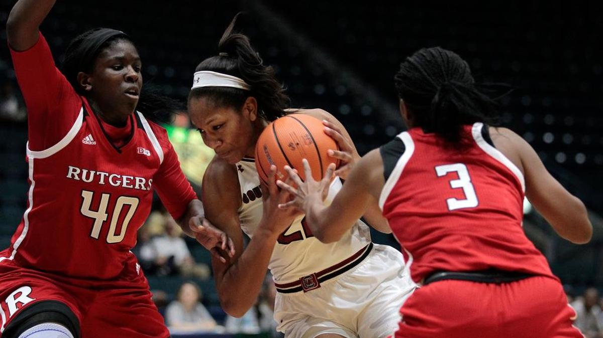 South Carolina's A'ja Wilson, center, is fouled as she drives the ball on Rutgers' Victoria Harris (40) and Tyler Scaife (3) during the first quarter of an NCAA college basketball game in the Gulf Coast Showcase tournament, Friday, Nov. 24, 2017, in Estero, Fla.