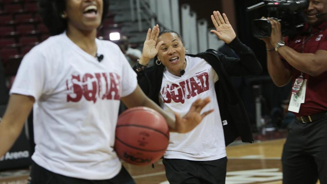 Coach Dawn Staley celebrates after sinking a half-court shot while competing with Tiffany Mitchell and Tina Roy during the NCAA watch party at the Colonial Life Arena. The Gamecocks were selected as the No. 1 seed in the Sioux Falls Region.
