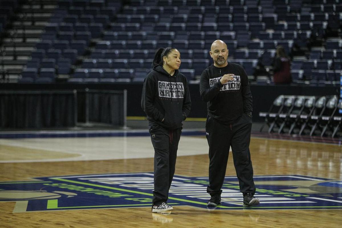 USC Head Coach Dawn Staley and Assistant Coach Fred Chmiel confer while preparing for the NCAA Regional game against Quinnipiac at the Stockton Arena in Stockton, Calif.