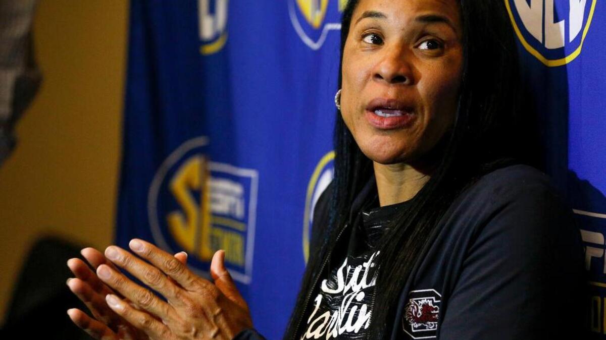 South Carolina women's NCAA college basketball coach Dawn Staley answers a question during the Southeastern Conference women's media day in Charlotte, N.C.