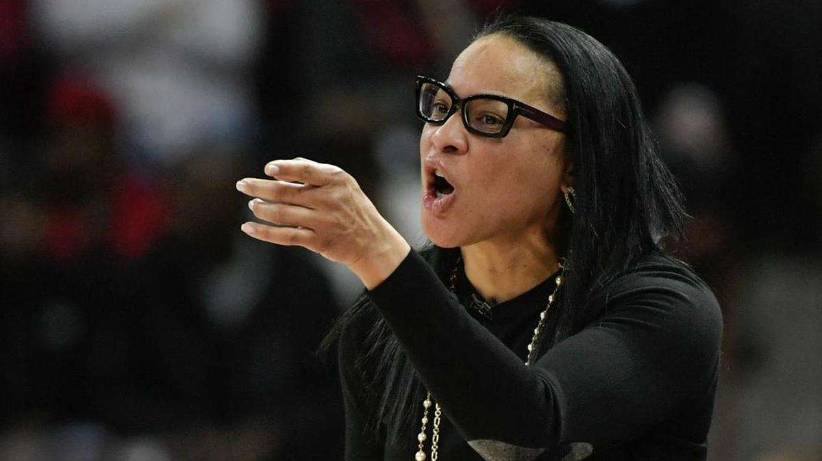Coach Dawn Staley talks to her team during a game this season.