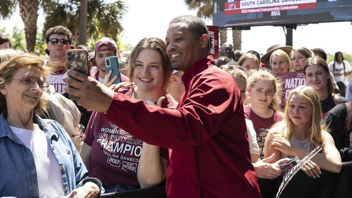 Lamont Paris has his picture taken with fans at Colonial Life Arena on Monday, April 4, 2022, following the Gamecocks’ win in the NCAA Women’s Basketball National Championship.