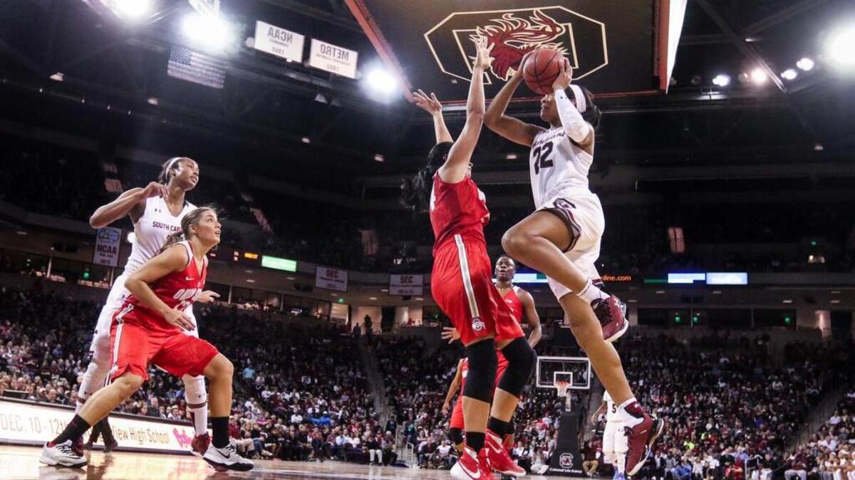 South Carolina's A'ja Wilson (22) drives around Ohio State's Makayla Waterman during the first half of the Gamecocks’ win Friday.
