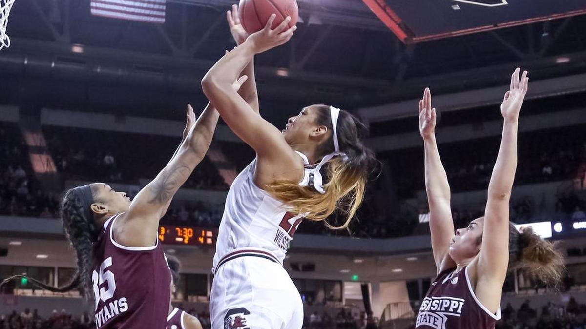 South Carolina's A'ja Wilson (22) shoots as Mississippi State's Victoria Vivians (35) and Mississippi State's Dominique Dillingham (00) defend during the first half of action in the Colonial Life Arena.