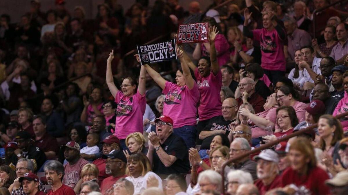 USC fans celebrate during the first half of the Gamecocks’ win over Jacksonville on Friday in the first round of the NCAA Tournament.