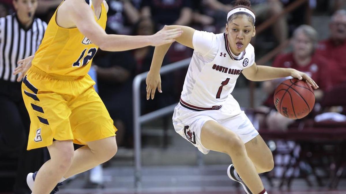 South Carolina's Bianca Cuevas-Moore (1) drives around Coker's Caitland Considine (12) during the first half of action in the Colonial Life Arena.