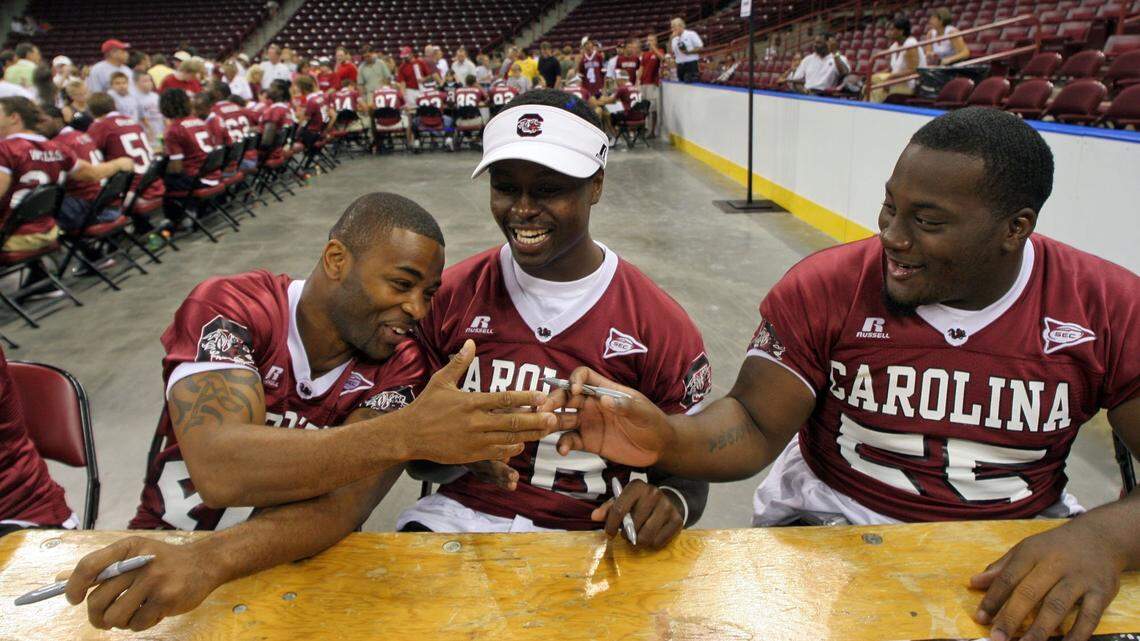 South Carolina football players wearing Russell Athletic branded jerseys.