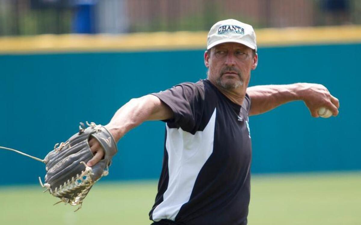 Coastal head Coach Gary Gilmore throws batting practice during one of the few final home practices before leaving for the College World Series in Omaha.