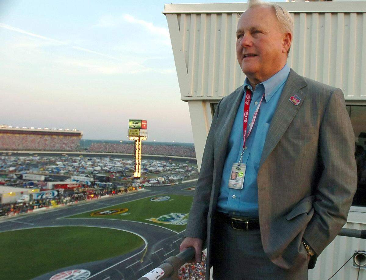 H.A. “Humpy” Wheeler looks out onto the running of the Coca-Cola 600 in 2010 at the speedway in Concord (now called Charlotte Motor Speedway). Wheeler retired from the track following the race.