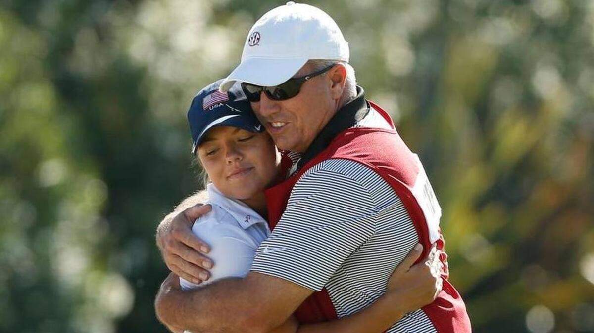 Lexington’s Lauren Stephenson gets a congratulatory hug from her father/caddie, Charles at The USGA Women’s Amateur in San Diego Stephenson advanced to final eight with a pair of wins Thursday.