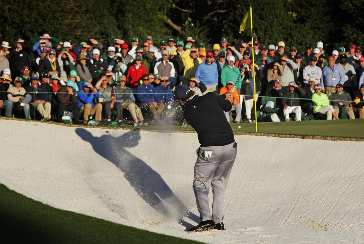 Phil Mickelson blasts out of the bunker on No. 17 during the second round of The Masters at Augusta National Golf Club in Augusta, Georgia, Friday, April 7, 2017.