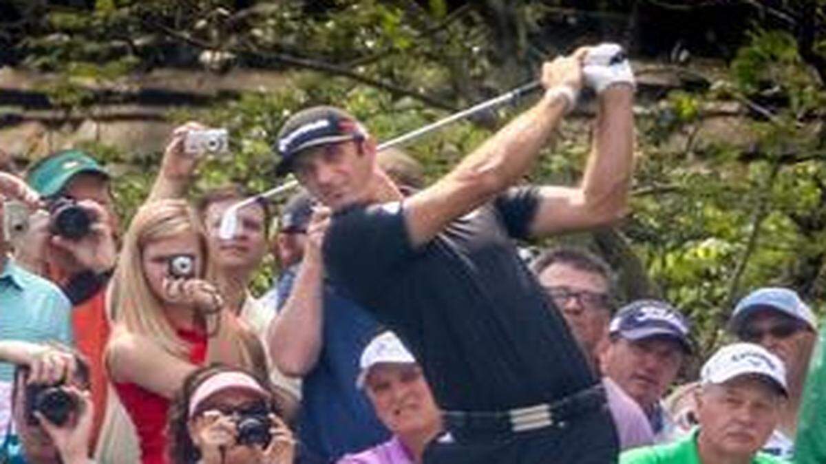 Dustin Johnson hits his tee shot Tuesday on the 16th hole during practice for the Masters in Augusta.