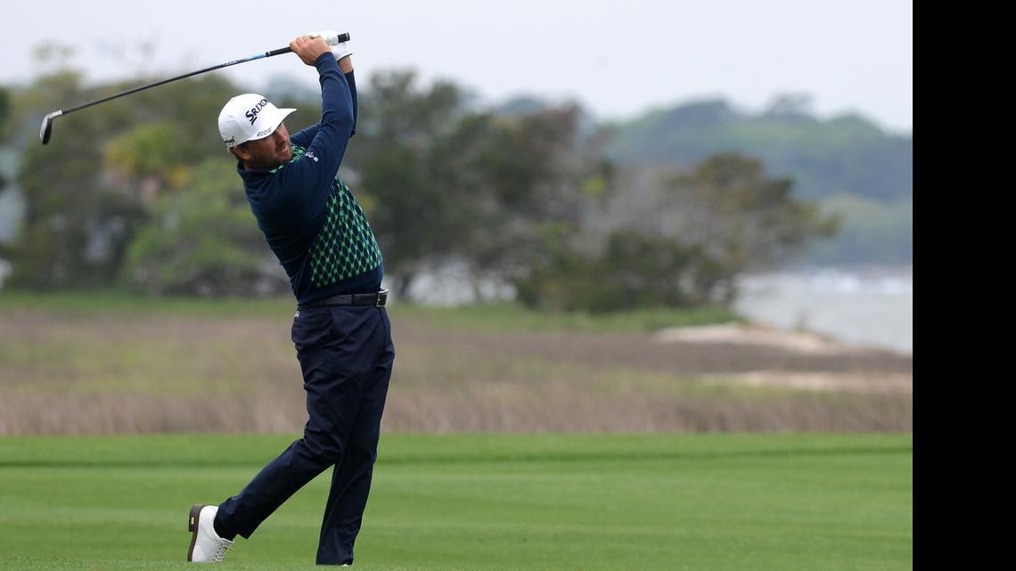 Graeme McDowell hits on the 18th fairway Thursday during the first round of the <252>RBC Heritage. He shot 66 to share the lead.