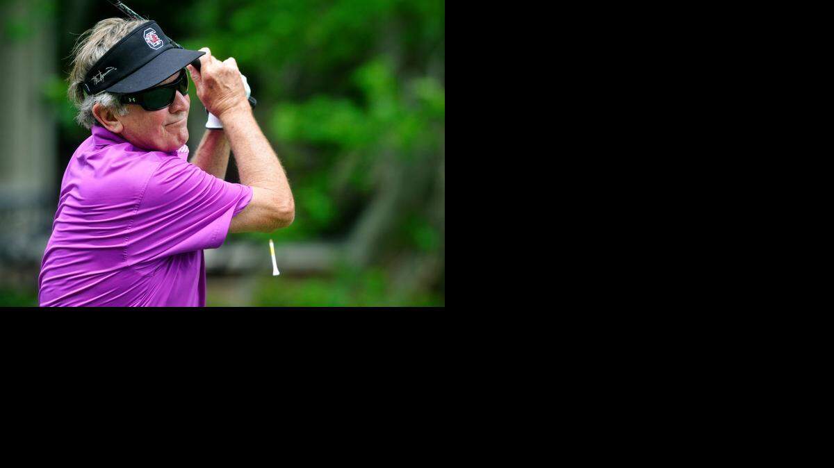 
USC football coach Steve Spurrier tees off on the par-5 second hole at Harbour Town Golf Links in Wednesday’s RBC Heritage Presented by Boeing pro-am.
