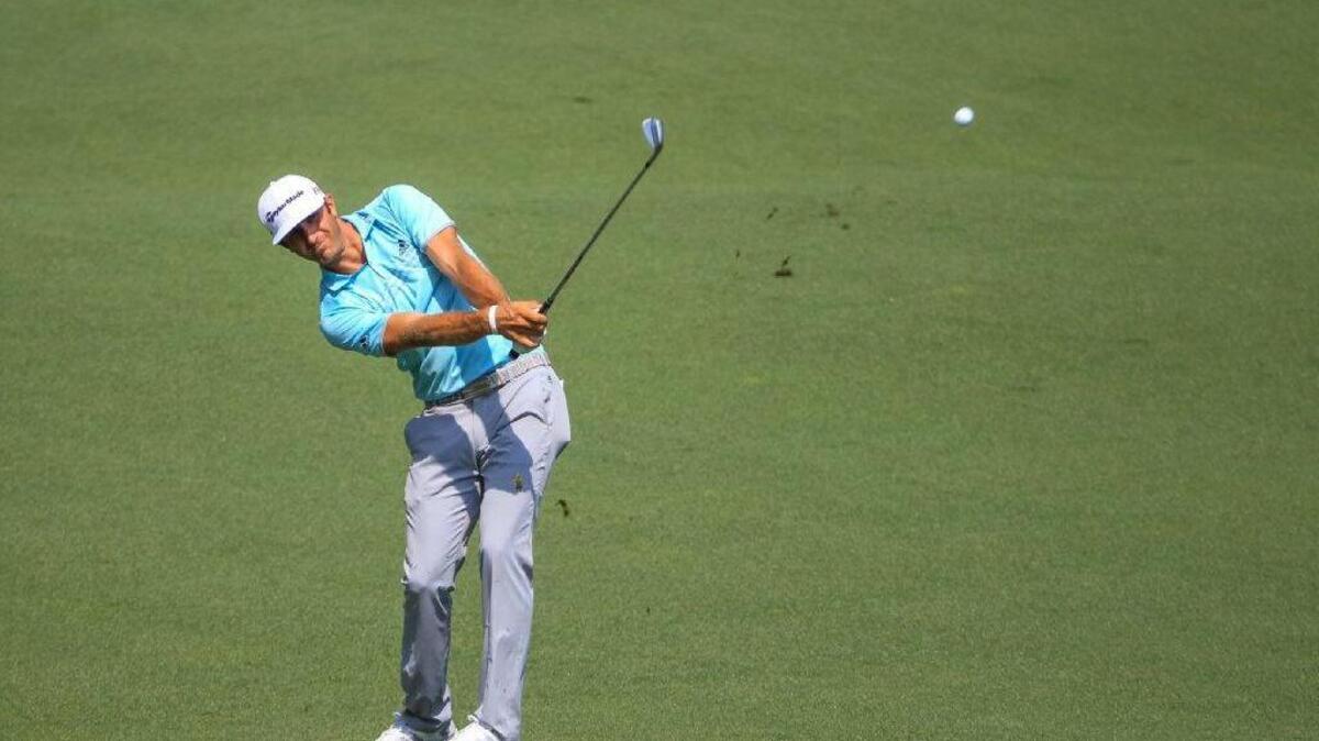 
Dustin Johnson hits his approach to the 7th green during the first round of the 2015 Masters golf tournament, Thursday April 09, 2015, in Augusta, Ga.
