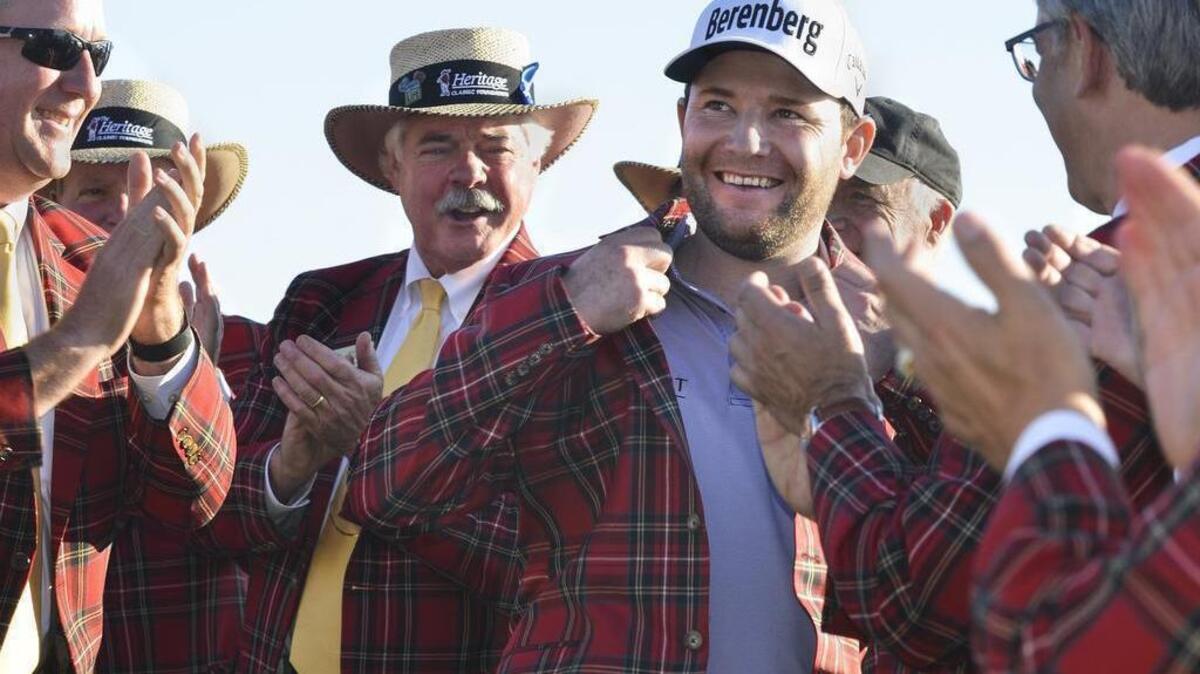 RBC Heritage 2016 champion Branden Grace is applauded as he tries on his tartan jacket during an award ceremony after the final round of the 48th annual RBC Heritage Presented by Boeing golf tournament April 17, 2016, at Harbour Town Golf Links on Hilton Head Island, S.C.