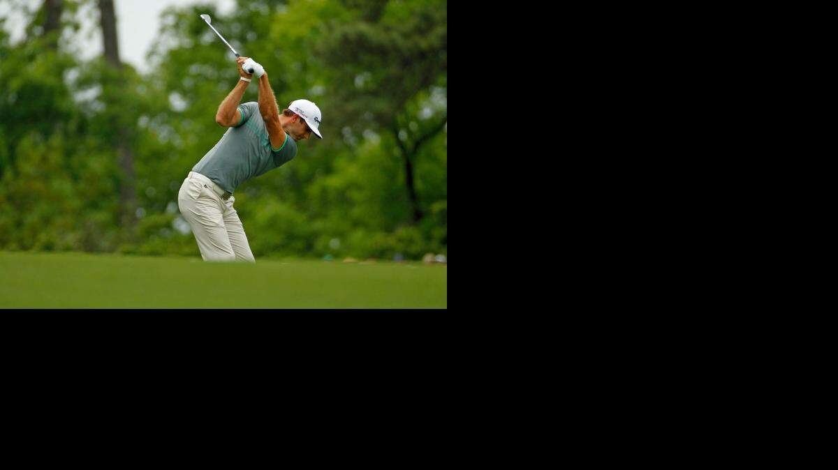
Dustin Johnson hits his approach on No. 1 during the Masters on Sunday.
