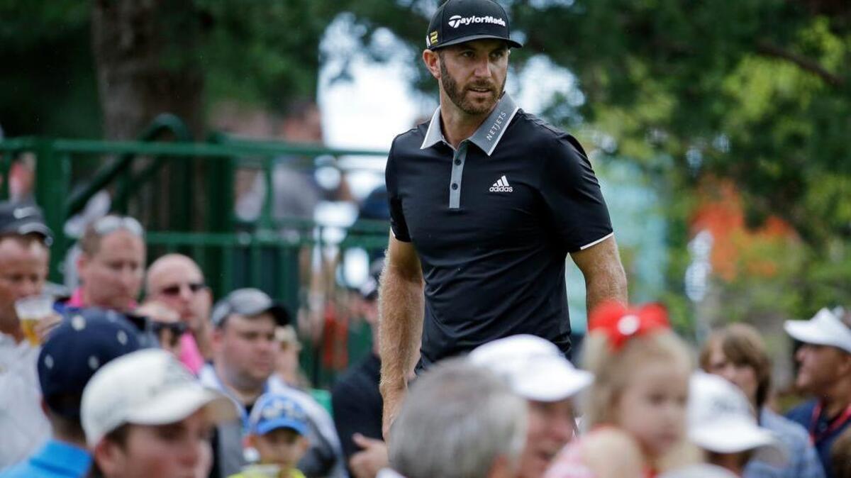 Dustin Johnson watches his tee shot on the 15th tee during the third round of the Memorial golf tournament, Saturday, June 4, 2016, in Dublin, Ohio.