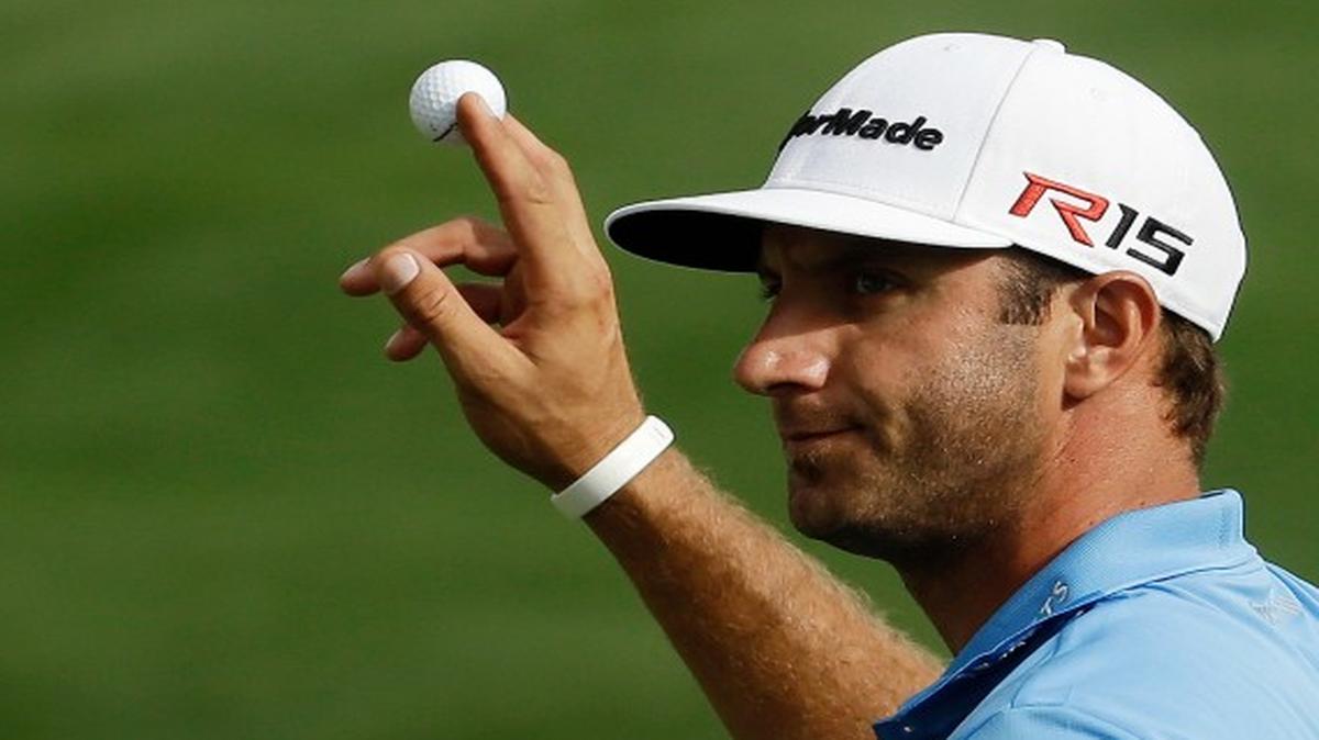 
Dustin Johnson holds up his ball after a birdie on the 15th hole during the second round of the Masters golf tournament Friday, April 10, 2015, in Augusta, Ga.

