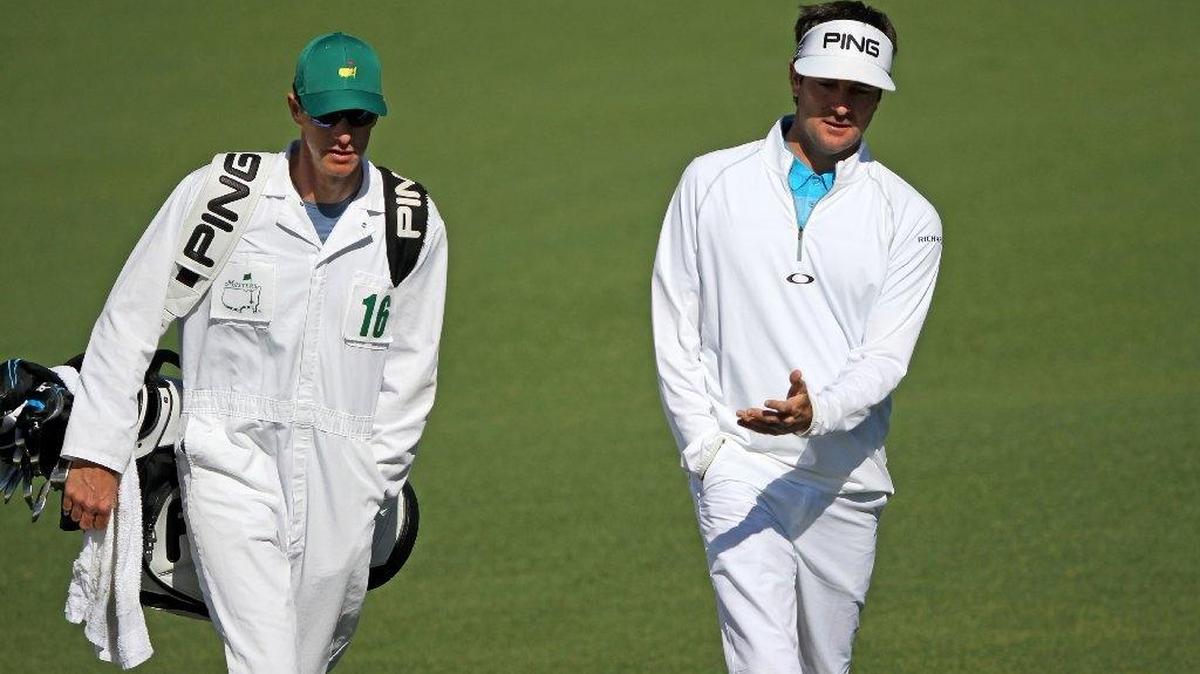 Augusta, GA - April 8, 2016: Bubba Watson talks to his caddie Ted Scott on No. 2 during the second round of The Masters at Augusta National Golf Club in Augusta, Ga.