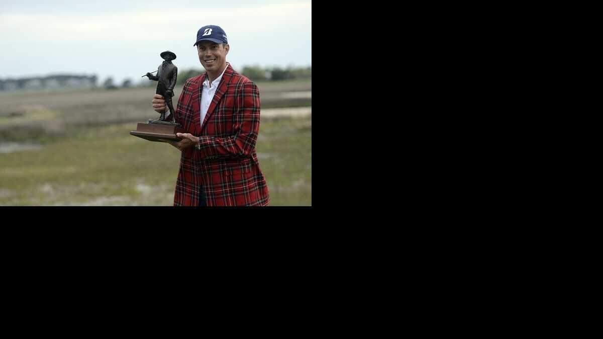 
Matt Kuchar smiles with his trophy on No. 18 after winning the 2014 RBC Heritage Presented by Boeing at Harbour Town Golf Links in Sea Pines on Hilton Head Island S.C.

