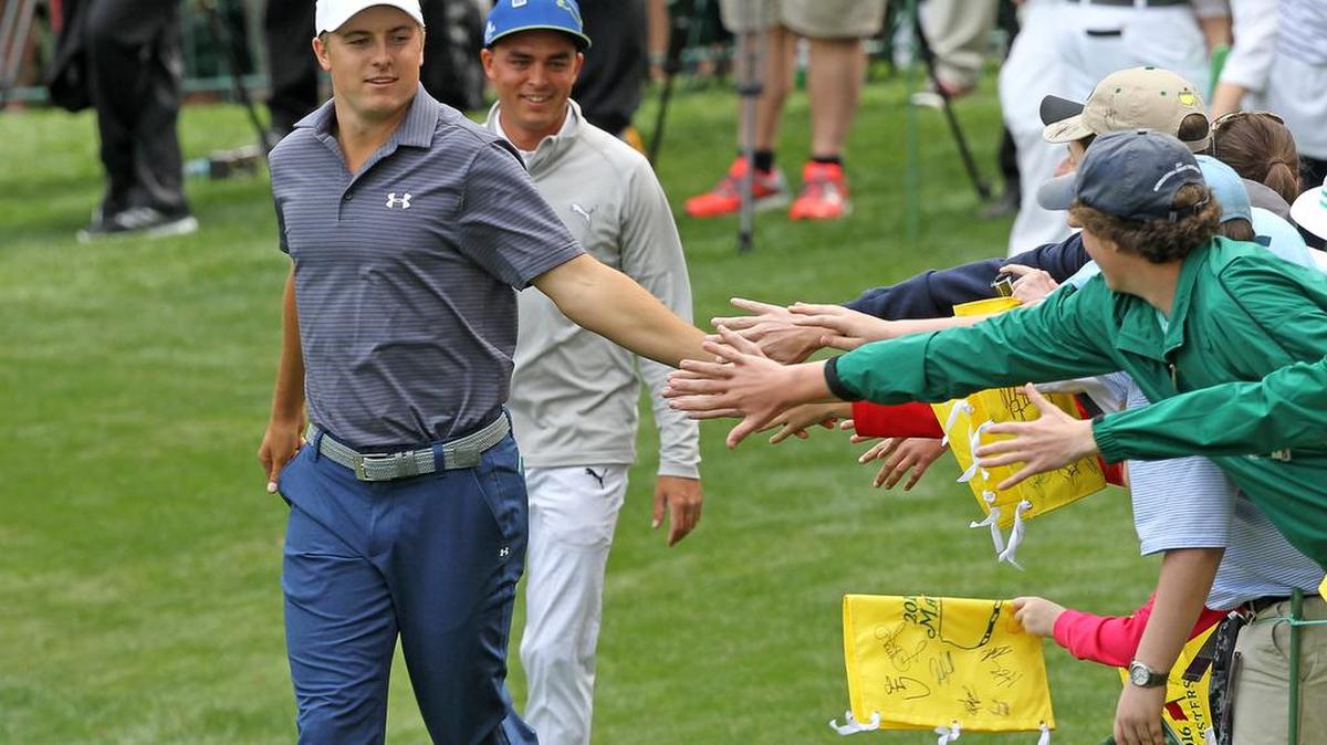 Jordan Spieth shakes hands with patrons during the Masters Par-3 Contest on Wednesday at Augusta National Golf Club in Augusta, Ga.