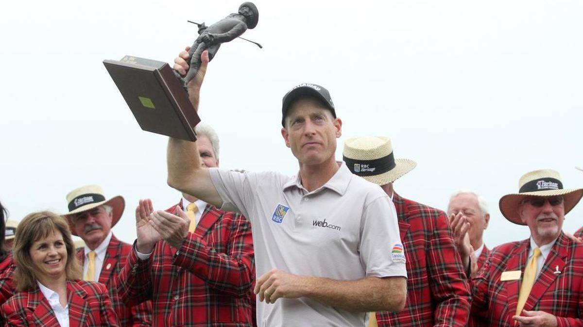 Jim Furyk holds the trophy after winning the RBC Heritage at Harbour Town Golf Links last year. Furyk won’t be able to defend his title this week because of a wrist injury.