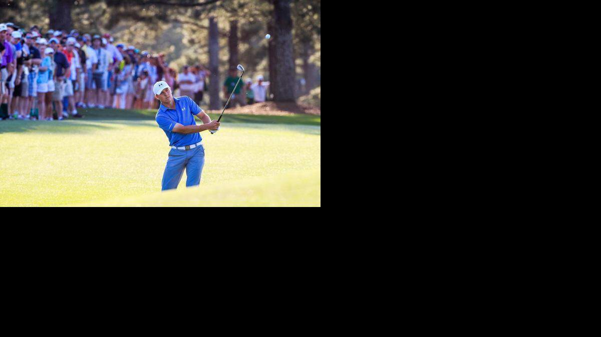 
Jordan Spieth chips to the 17th green during the third round of the 2015 Masters golf tournament, Saturday April 11, 2015, in Augusta, Ga. Spieth double bogeyed the 17th but is leading by four strokes going into the final round. 

