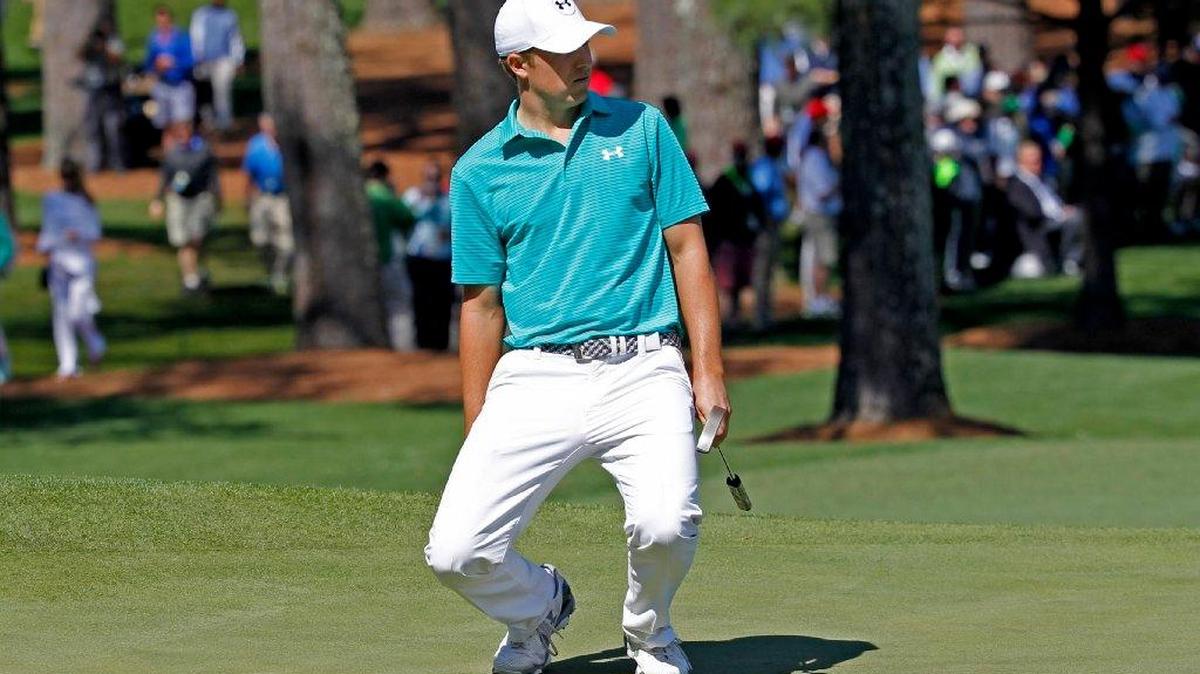 Jordan Spieth reacts to his putt on No. 7 during the first round of The Masters at Augusta National Golf Club in Augusta, Ga.