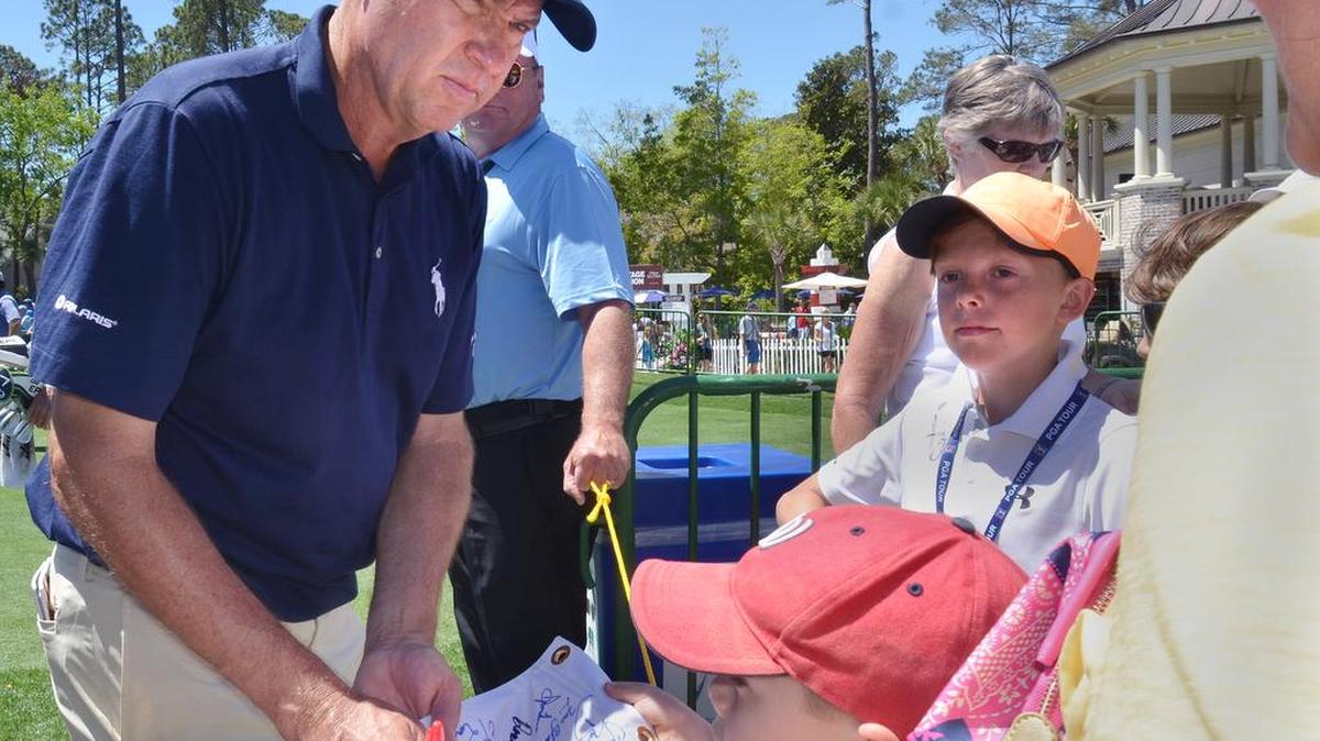Davis Love III pauses between the ninth hole and 10th green to sign a few autographs during his Tuesday practice round for the RBC Heritage Presented by Boeing on April 11, 2017 at Harbour Town Golf Links on Hilton Head Island.