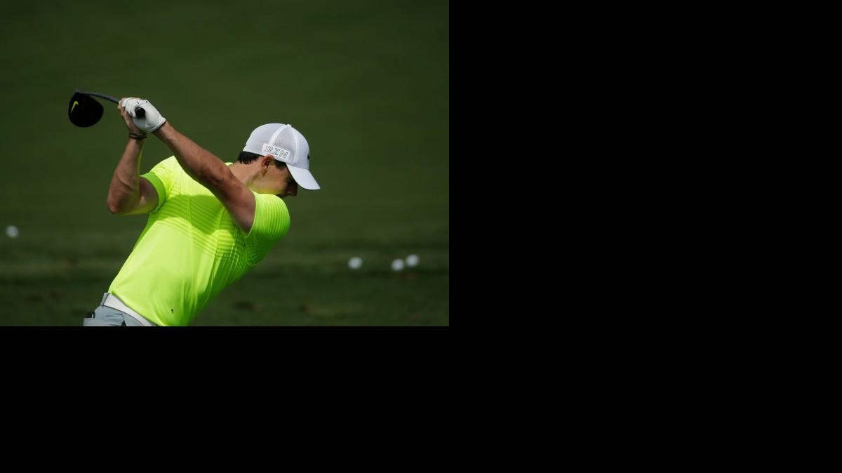 
Rory McIlroy, of Northern Ireland, hits on the driving range during a practice round for the Masters golf tournament Tuesday, April 7, 2015, in Augusta, Ga. 
