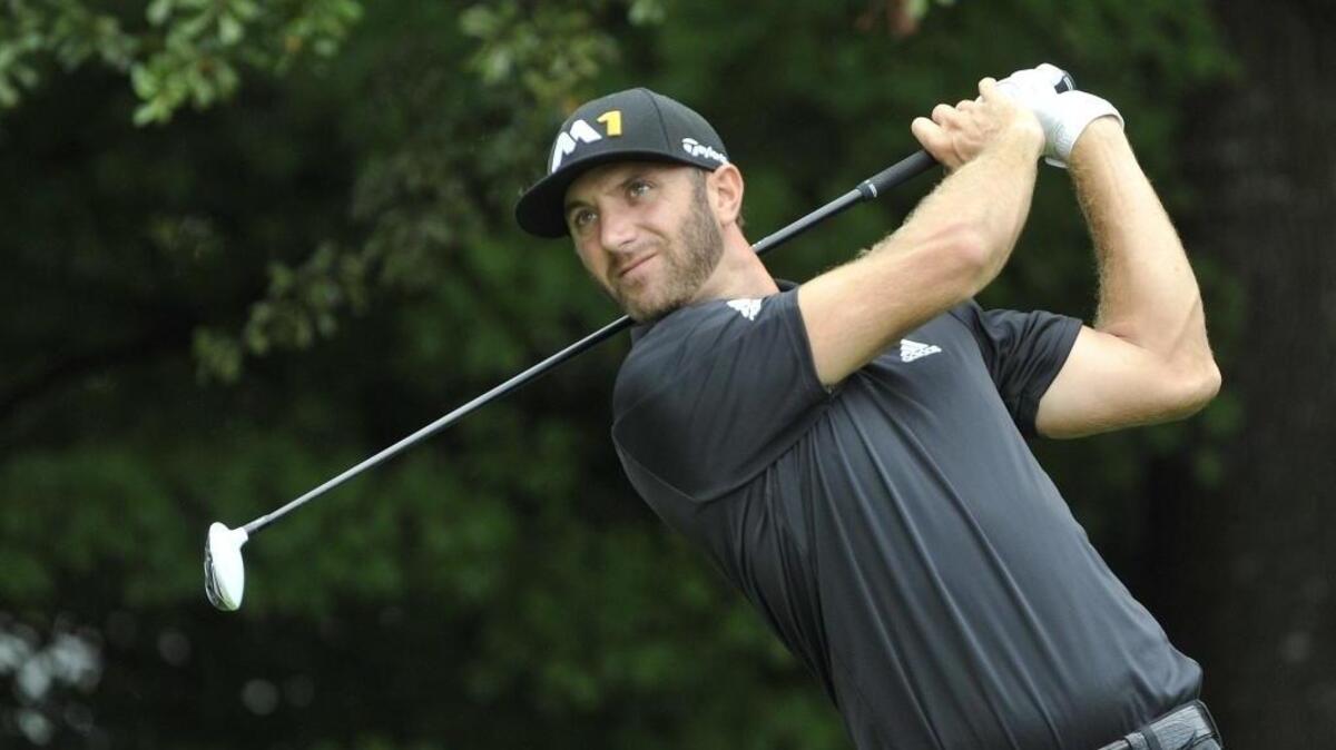 
Dustin Johnson tees off on the third hole during the second round of the Tour Championship golf tournament at East Lake Club Friday, Sept. 25, 2015, in Atlanta. 
