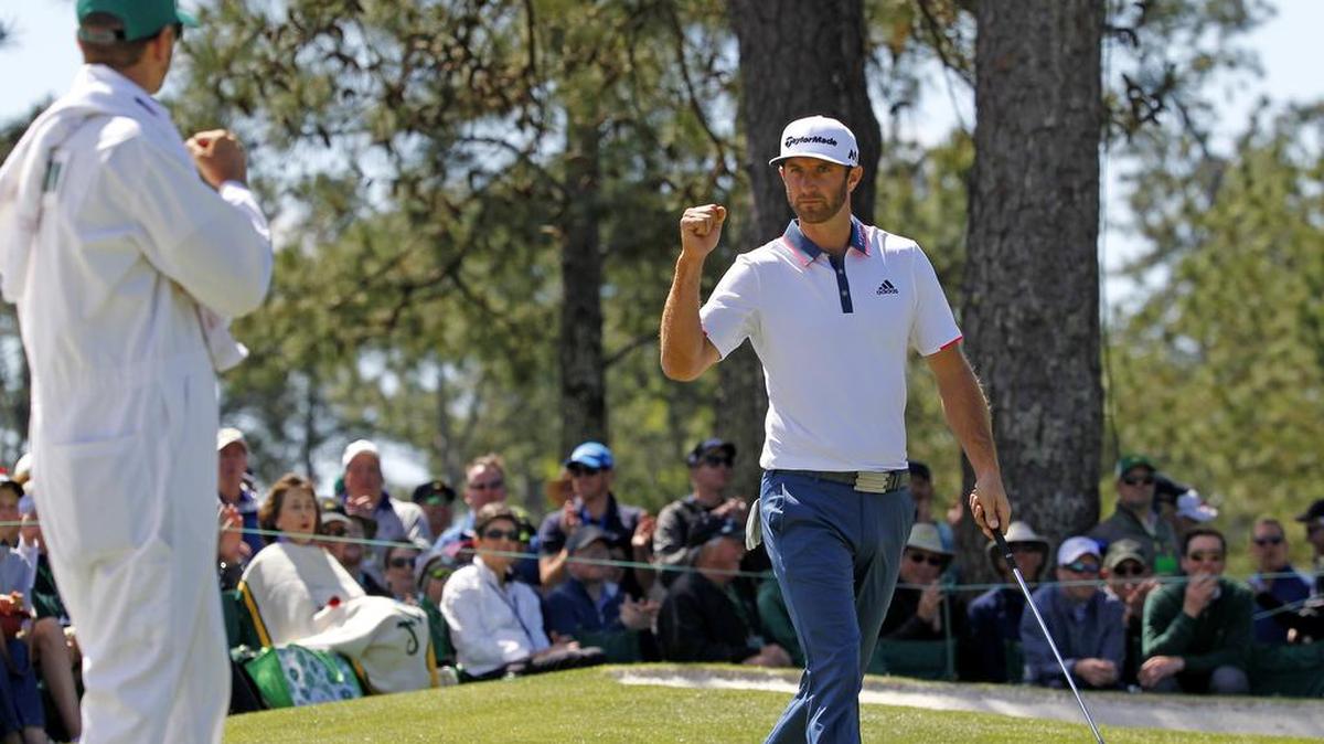 Dustin Johnson reacts after a birdie on No. 7 during the first round of The Masters at Augusta National Golf Club in Augusta, Ga.