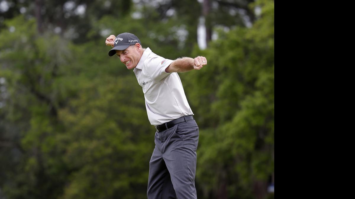 
Jim Furyk celebrates after sinking his winning putt on the second playoff hole of the RBC Heritage’s final round in Hilton Head Island on Sunday. Furyk beat Aiken native Kevin Kisner in the playoff. 
