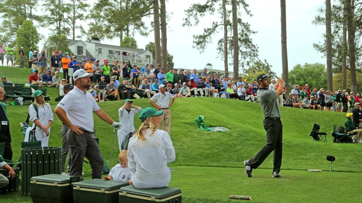 Augusta, GA - April 6, 2016: Dustin Johnson hits his tee shot on No. 8 during the Masters Par-3 Contest at Augusta National Golf Club in Augusta, Ga.