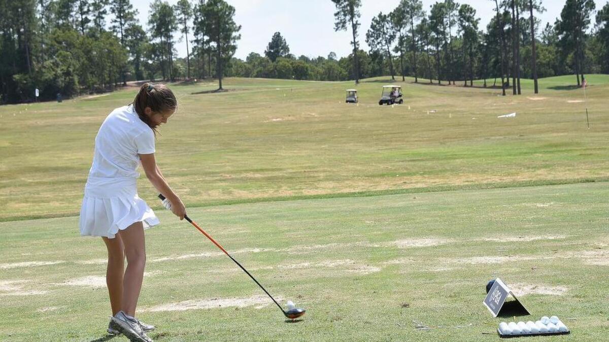 Ella Stalvey, of Elgin, competes in the driving part of the competition in the girls 12-13 age bracket at the Drive, Chipp and Putt sub-regional competition at Fort Jackson on Saturday.