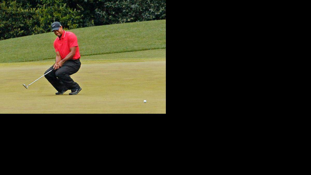 
Tiger Woods reacts after his birdie putt on hole No. 4 comes up short during Sunday's round of The Masters last year at Augusta National Golf Club in Augusta, Georgia.
